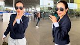 Malaika Arora adds power twist to her airport look ft. short blue blazer and denim pants with a Rs 6.69 lakh Bottega Veneta bag