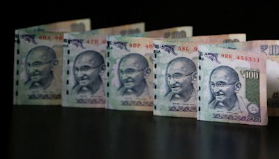 Rupee nudges higher tracking Asian peers; India budget awaited