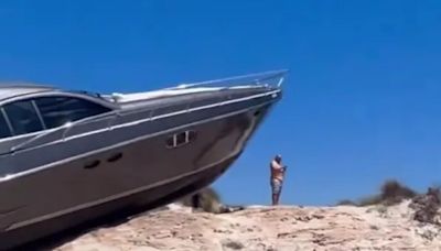 Moment tourists find yacht on top of sand dune after ‘navigation error’