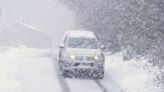 Amber weather warning in force as snow brings travel disruption