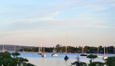 America’s Best Small Lake Town Has Dazzling Waters, Uncrowded Beaches, and a 20-mile-long Tunnel of Trees