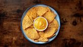 Expert Tips For Heating (And Reheating) Your Nacho Cheese Sauce