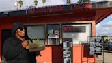 Customers wait hours for tacos from this Leimert Park window. They're worth it