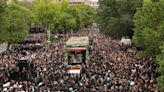 Thousands turn out to mourn Iran’s President Raisi as others celebrate his death