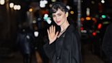 Lily Collins Channels Audrey Hepburn in a Black Cocktail Dress and Fishnet Veil