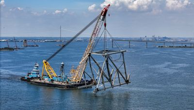 Third, final large segment of Baltimore’s Key Bridge lifted out of water Tuesday morning