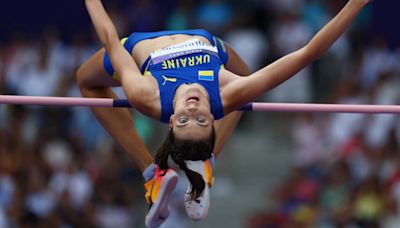 Athletics-Ukraine and Canada shine in high jump, hammer throw qualifying