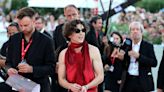 Timothée Chalamet Matches Red Carpet in Fiery Backless Top and Pants with Black Boots at Venice Film Festival