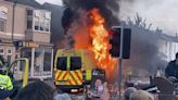 As an English town reels from the killing of 3 children, police face violent far-right protests