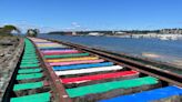 Olympia volunteers repaint ‘Rainbow Rails’ after longtime attraction was defaced