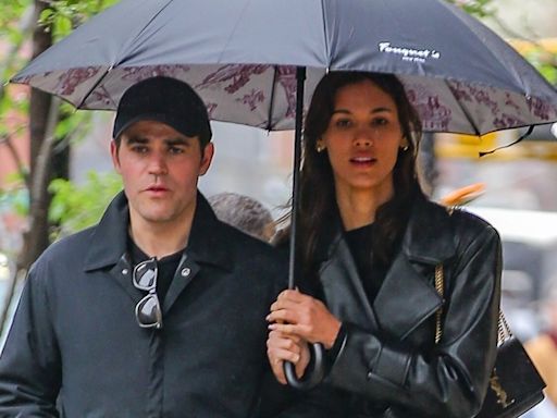 Paul Wesley & Girlfriend Natalie Kuckenburg Share an Umbrella During Rainy Day Outing