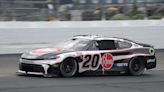 Christopher Bell takes the checkered flag on rain tires in the NASCAR Cup race at New Hampshire