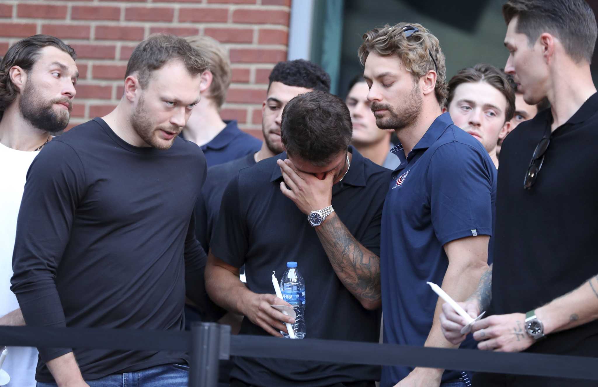 Blue Jackets fans and players remember the Gaudreau brothers at a candlelight vigil in Columbus