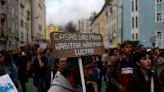 Tent-dwelling migrants join protest over Portugal's housing prices