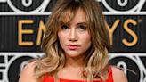 Suki Waterhouse tops off her layered bouffant with a retro stary tiara