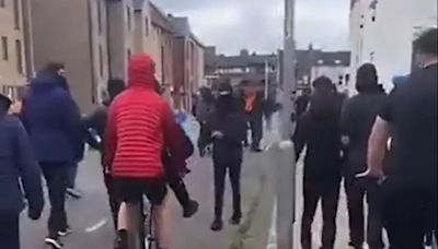 Moment yobs rampage through streets destroying cars in shocking video