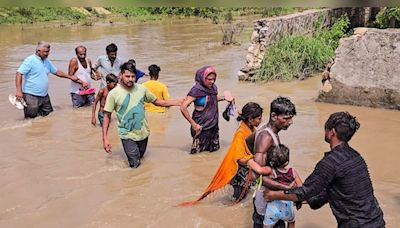 Watch: Residents of Delhi's JJ Colony walk in knee-deep water after flooding due to Munak Canal breach - CNBC TV18