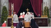 Pope Emeritus Benedict XVI laid to rest by his successor, Pope Francis