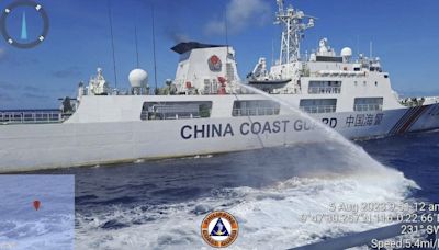 Philippine forces sail to hotly disputed shoal without incident for first time since deal with China