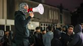 Hundreds of protesters gather outside Rochdale Police Station after video shows officer stamping on man's head