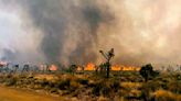 Wildfire burns at California-Nevada border, spawning fire tornadoes, torching desert landscape
