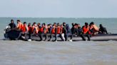 Moment dingy packed with migrants sets off as French police watch on