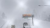 Powerful storm in California and Nevada shuts interstate and dumps snow on mountains