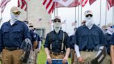 Videos: White supremacist Patriot Front group marches through city
