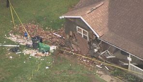 Man dies after driving into home during storms