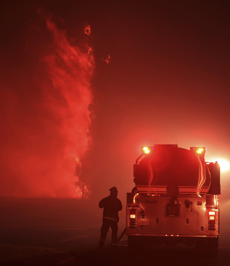 California firefighters continue battling wind-driven wildfire east of San Francisco
