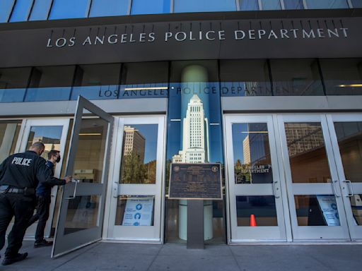 Investigation underway after video shows LAPD officer punch handcuffed man