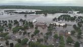 Millions swelter as temperatures soar across the US, while floodwaters inundate the Midwest