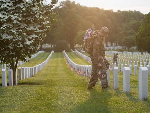 US Army soldiers place flags on Arlington National Cemetery gravesites in annual tradition