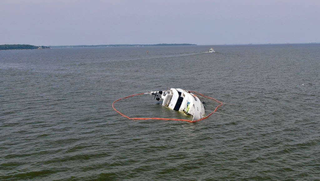 Overturned yacht off Anne Arundel coast remains stranded; oil leak contained