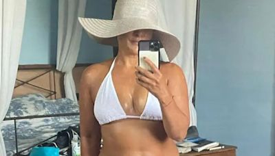 Loose Women's Saira Khan, 54, strips to barely-there white bikini