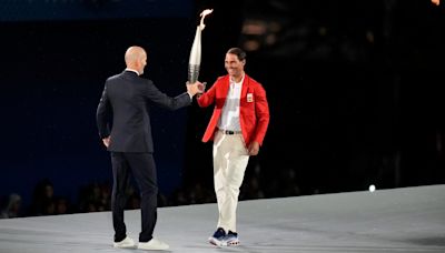 Zinedine Zidane passes torch to Rafael Nadal during star-studded Paris Olympics 2024 opening ceremony