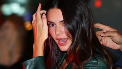 Kendall Jenner puts on a leggy display in a green leather mini skirt