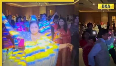 WATCH: video of groom's mother dancing with a glass of whisky on her head goes viral, WATCH