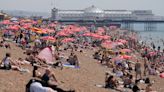 Brits head to the beach and flock to Glastonbury in 31C scorcher