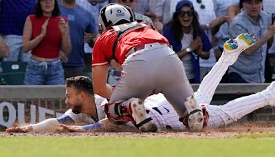 Friday's MLB Roundup: Reds hold off Cubs on clutch relay throw in 9th