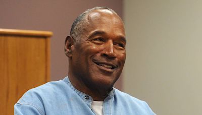 O.J. Simpson Heisman Trophy, other possessions to be auctioned to pay off debt