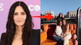 Courteney Cox photobombs 'Friends' fans posing on the iconic orange couch at Warner Bros. Studios