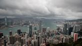 Cyclone, absences threaten to dull Hong Kong finance meeting