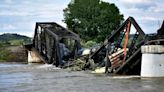 Train derailment on Montana bridge sends multiple rail cars into the Yellowstone River