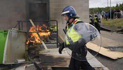 Demonstrators attack police and target hotel as riots continue