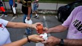 As Spain swelters, volunteers serve cold soup to homeless