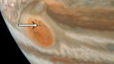 Mysterious Moon Photobombs Jupiter's Great Red Spot in Latest Juno Image