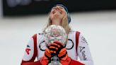 Huetter wins World Cup downhill race to clinch her 1st title and deny Gut-Behrami her 4th of season