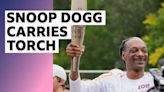 Snoop Dogg carries Olympic torch through Paris before opening ceremony