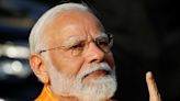 India election: Narendra Modi casts vote as fears grow among the country's Muslims